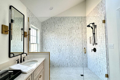 Inspiration for a mid-sized timeless master black and white tile and matchstick tile porcelain tile and double-sink doorless shower remodel in St Louis with recessed-panel cabinets, light wood cabinets, white walls, quartzite countertops, a hinged shower door, white countertops and a built-in vanity
