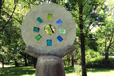 Cement & glass garden sculpture that is stunning when backlit by sunlight or art
