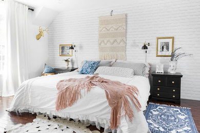 Example of a large transitional master dark wood floor and brown floor bedroom design in Montreal with white walls