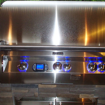 L Shaped Outdoor Kitchen With Unique Lighting