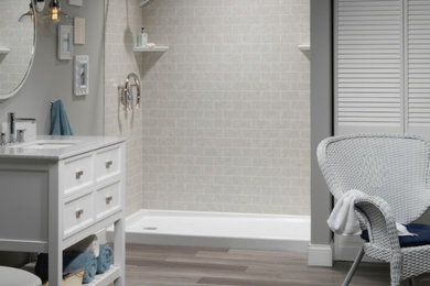 Mid-sized trendy 3/4 gray tile and subway tile gray floor bathroom photo in Chicago with shaker cabinets, white cabinets, a two-piece toilet, gray walls, an undermount sink and white countertops