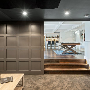 Home theater - mid-sized midcentury modern enclosed carpeted and brown floor home theater idea in Brisbane with brown walls and a projector screen