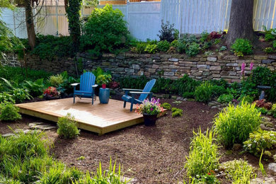Mid-sized elegant backyard deck container garden photo in Philadelphia