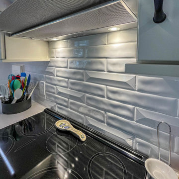 Custom Two-Toned Green and White Kitchen with Laventa Carrara Quartz Countertops