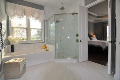 Example of a large trendy master white tile and stone tile marble floor bathroom design in Charlotte with white walls