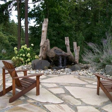 Sandstone patio with natural rock water feature