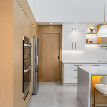 Appliance Wall with Tall Cabinets and Seamless Transitions