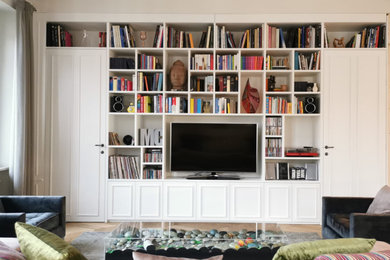 Esempio di un grande soggiorno contemporaneo stile loft con libreria, pareti bianche e parete attrezzata