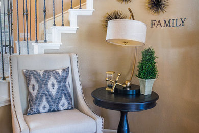 Entryway - mid-sized transitional medium tone wood floor and brown floor entryway idea in Austin with brown walls and a white front door