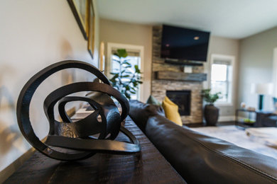 Trendy open concept living room photo in Other with a wall-mounted tv