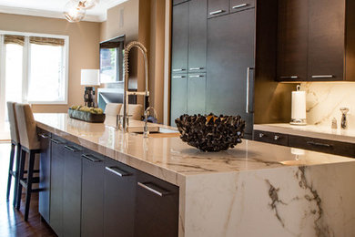 This is an example of a large contemporary l-shaped separate kitchen in Chicago with an undermount sink, flat-panel cabinets, dark wood cabinets, marble benchtops, brown splashback, marble splashback, stainless steel appliances, dark hardwood floors, with island and brown floor.