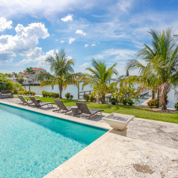 Modern Outdoor Pool Design with Tropical Ambiance – Luxury Home Remodeling Inspi