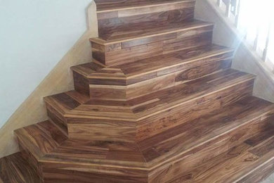 Inspiration for a contemporary wooden staircase remodel in Austin with wooden risers