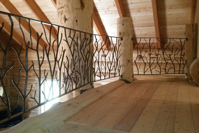 Family room - small rustic loft-style light wood floor and beige floor family room idea in San Diego with brown walls, no fireplace and no tv