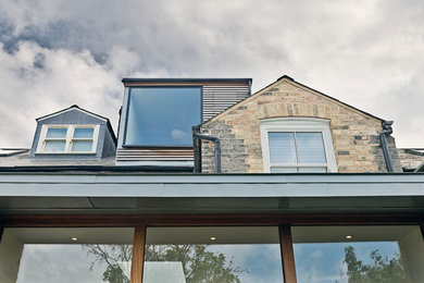 Design ideas for a small and beige midcentury terraced house in Cambridgeshire with three floors, mixed cladding, a pitched roof and a mixed material roof.