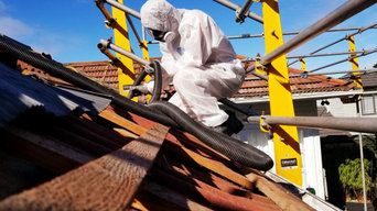 Asbestos containing roof removal