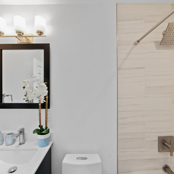 Modern Bathroom with Framed Mirror & Vanity Lights