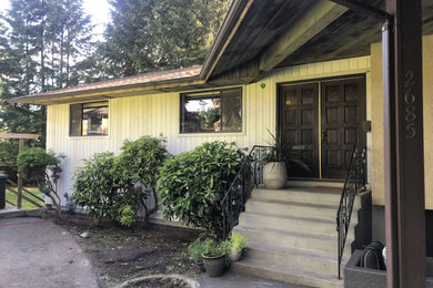 Example of a small one-story wood house exterior design in Vancouver