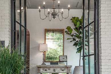 Large elegant slate floor and gray floor entryway photo in Houston with gray walls and a metal front door