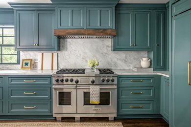 Example of a large transitional galley dark wood floor and brown floor eat-in kitchen design in Birmingham with a single-bowl sink, recessed-panel cabinets, green cabinets, marble countertops, gray backsplash, marble backsplash, paneled appliances, an island and gray countertops