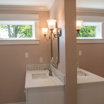 Double vanity divided by wall