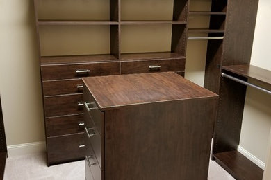 Inspiration for a mid-sized timeless gender-neutral carpeted and beige floor walk-in closet remodel in Atlanta with open cabinets and dark wood cabinets