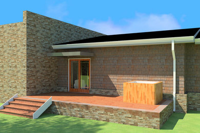 Mid-sized trendy brown one-story stone house exterior photo in Other with a hip roof and a metal roof