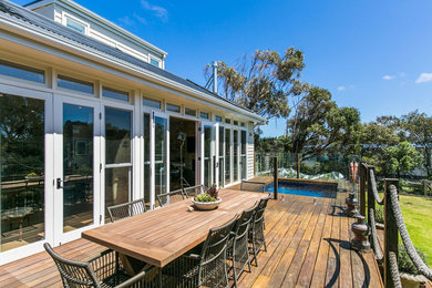Photo of a large traditional backyard deck in Other with an outdoor kitchen and no cover.