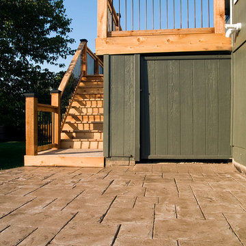 Smith - Cedar deck in Kansas City with stamped concrete patio.