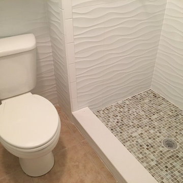 Fiberglass shower replacement with tile shower.