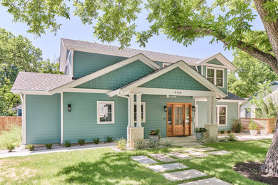 Inspiration for a mid-sized coastal two-story house exterior remodel in Austin with a shingle roof