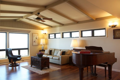 Inspiration for a mid-sized tropical enclosed dark wood floor living room remodel in Hawaii with a music area and beige walls