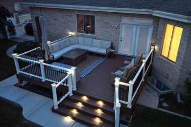 Inspiration for a mid-sized backyard metal railing deck remodel in Salt Lake City with no cover