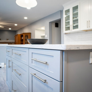 Elegant white kitchen with grey island