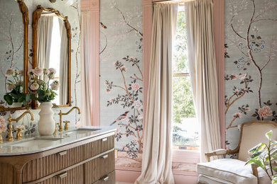 Inspiration for a timeless marble floor, white floor, double-sink and wallpaper bathroom remodel in Austin with furniture-like cabinets, medium tone wood cabinets, an undermount sink, marble countertops, white countertops and a freestanding vanity