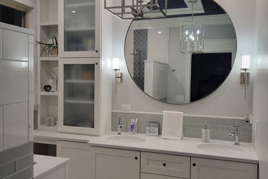 Example of a mid-sized transitional master white tile and ceramic tile porcelain tile, gray floor, double-sink and tray ceiling bathroom design in Cincinnati with shaker cabinets, white cabinets, a two-piece toilet, gray walls, an undermount sink, quartzite countertops, gray countertops, a niche and a built-in vanity