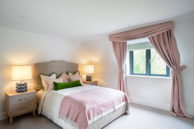 Photo of a contemporary bedroom in Surrey.