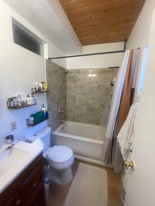 How do I work with pine ceilings and dated tile in this tiny bathroom?