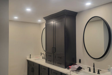 Large elegant master double-sink and brown floor bathroom photo in Philadelphia with shaker cabinets, marble countertops, white countertops, a built-in vanity and an undermount sink