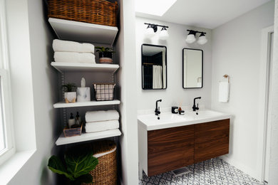 Bathroom - mid-sized 1950s master porcelain tile and double-sink bathroom idea in Seattle with flat-panel cabinets, medium tone wood cabinets, quartz countertops, white countertops and a floating vanity