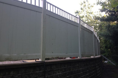 Re-Install of 6 Foot vinyl Fence on a block wall