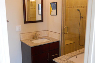 Example of a mid-sized master bathroom design in San Francisco with beaded inset cabinets and white walls