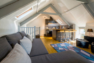 Living room - small contemporary open concept light wood floor and brown floor living room idea in Cornwall with white walls and no fireplace