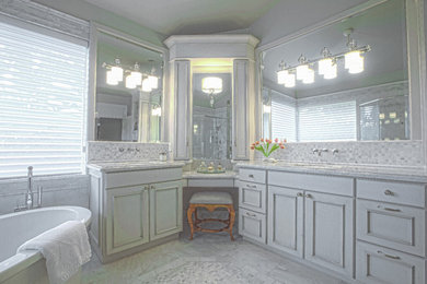 This is an example of a mid-sized transitional master bathroom in Miami with beaded inset cabinets, white cabinets, a freestanding tub, grey walls, marble floors, an undermount sink and marble benchtops.