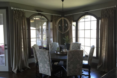 Large mountain style dark wood floor and brown floor dining room photo in Kansas City
