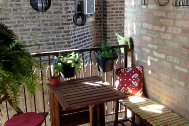 Example of a small trendy backyard deck container garden design in Chicago
