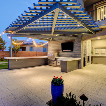 Wide-angle uneven U-shaped Outdoor Kitchen Design by Custom Outdoor Living