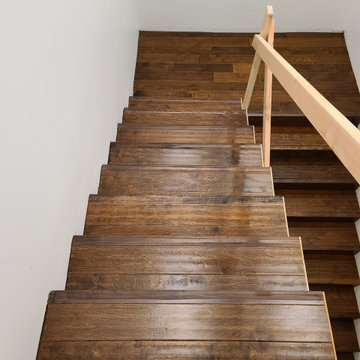 Sleek Engineered Hardwood & Modern Sliding Door by I’m The Man Services
