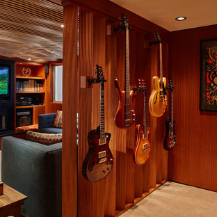 This is an example of a medium sized midcentury look-out basement in Portland with beige walls and carpet.