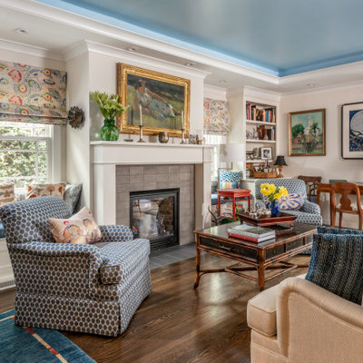 Living room - traditional dark wood floor, brown floor and tray ceiling living room idea in San Francisco with beige walls, a standard fireplace and a tile fireplace